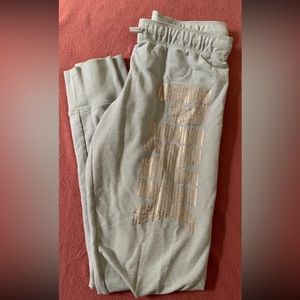 VS PINK jogger pants, with tapered gold lettering. Like new condition.